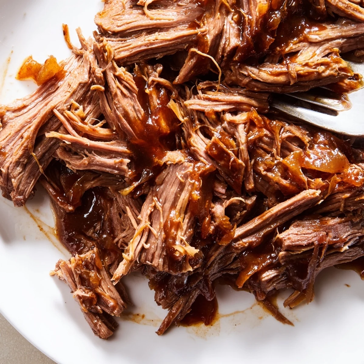 The shredded, tender beef from Crock Pot Korean Beef is served in a rustic clay pot, accompanied by steamed broccoli florets for a wholesome, colorful family meal.