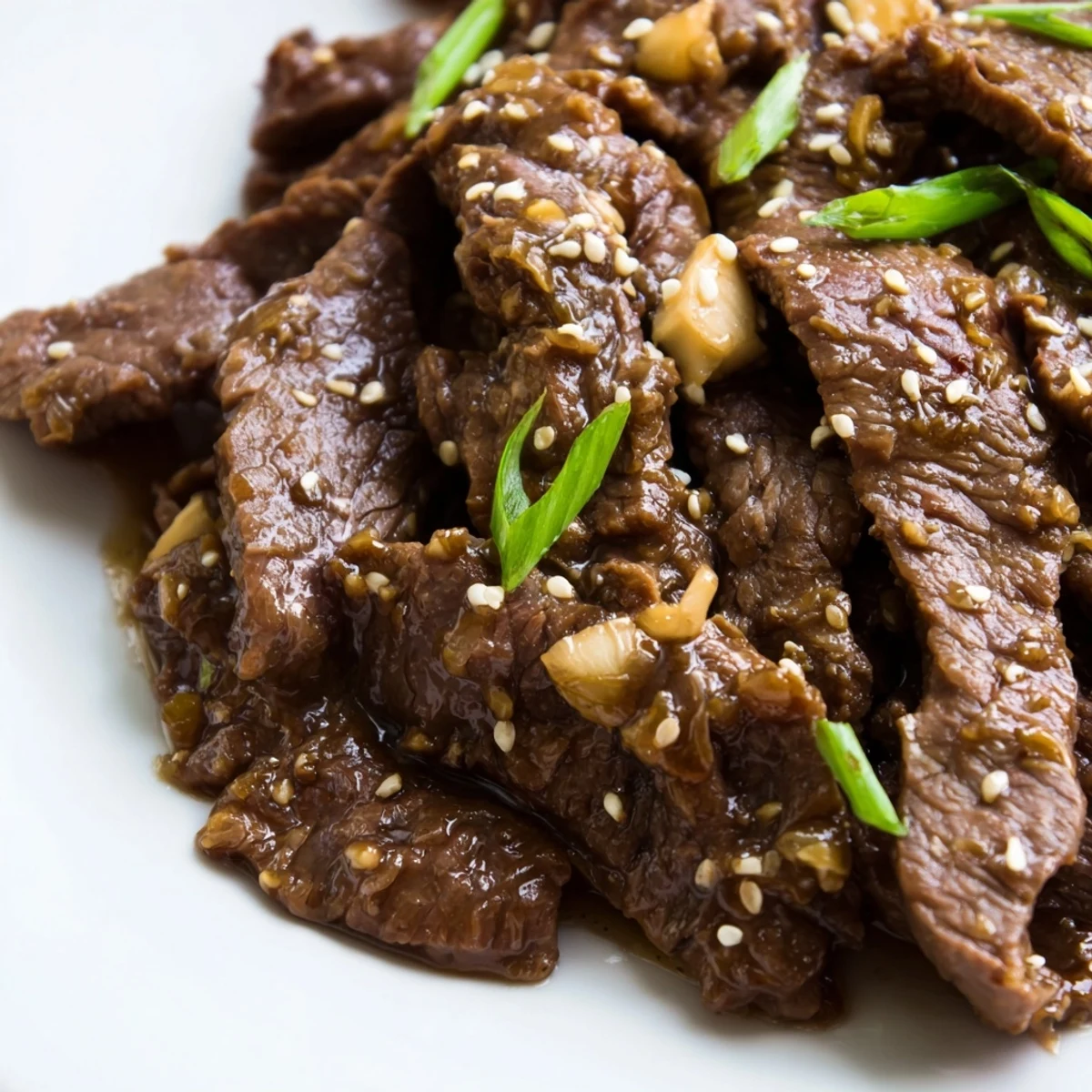 Tender strips of Ultimate Slow Cooker Mongolian Beef simmered in a rich, glossy sauce with garlic and ginger.
