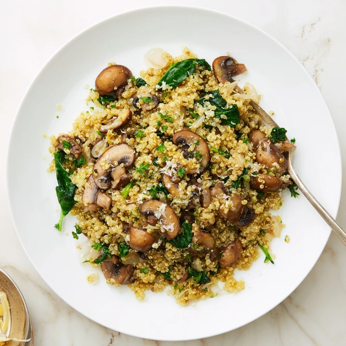 A close-up of Garlicky Mushroom Quinoa reveals tender greens and savory aromas perfect for weeknight dinners.