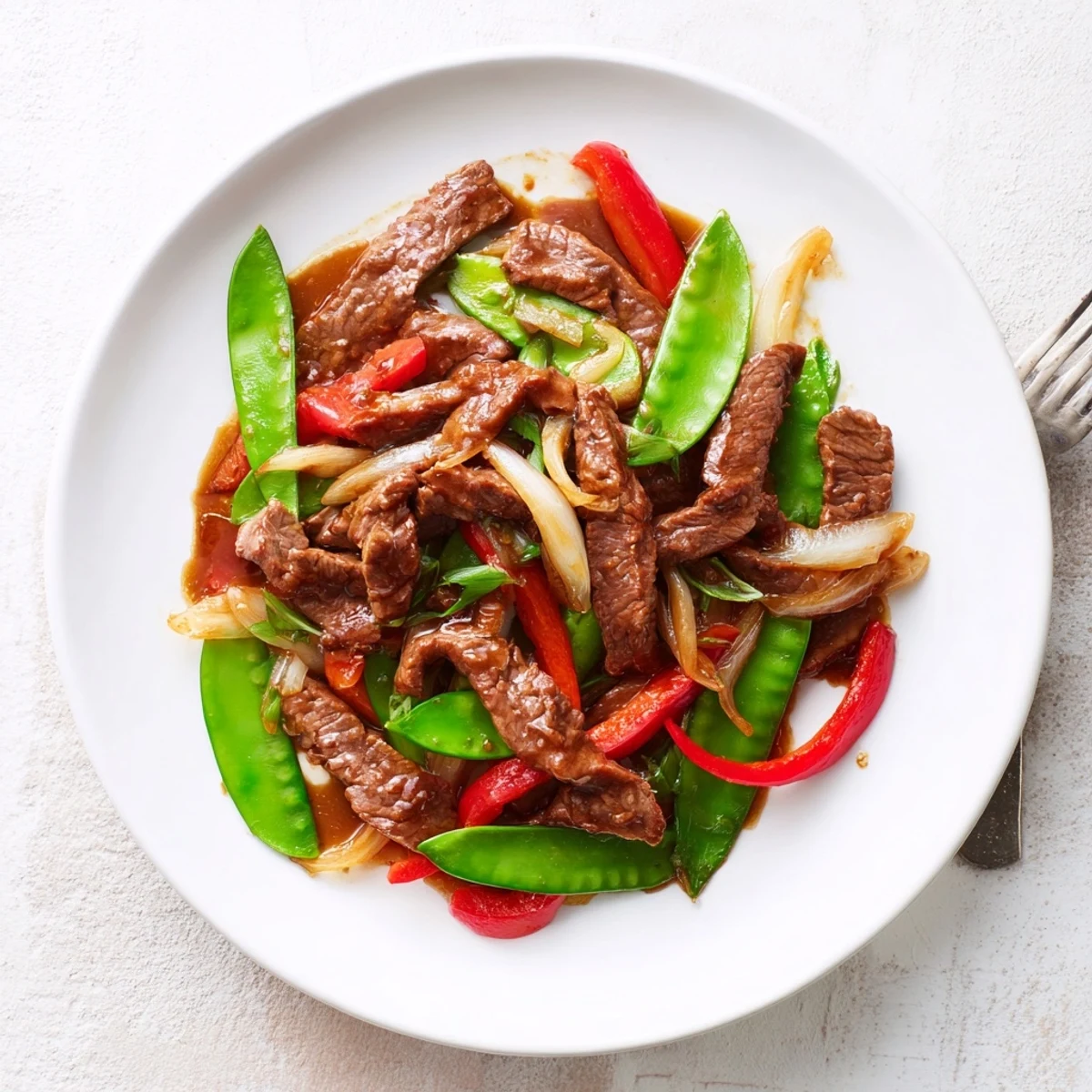 Tender beef and crisp vegetables glisten in savory oyster sauce in this Beef With Oyster Sauce stir-fry ready for a weeknight dinner.
