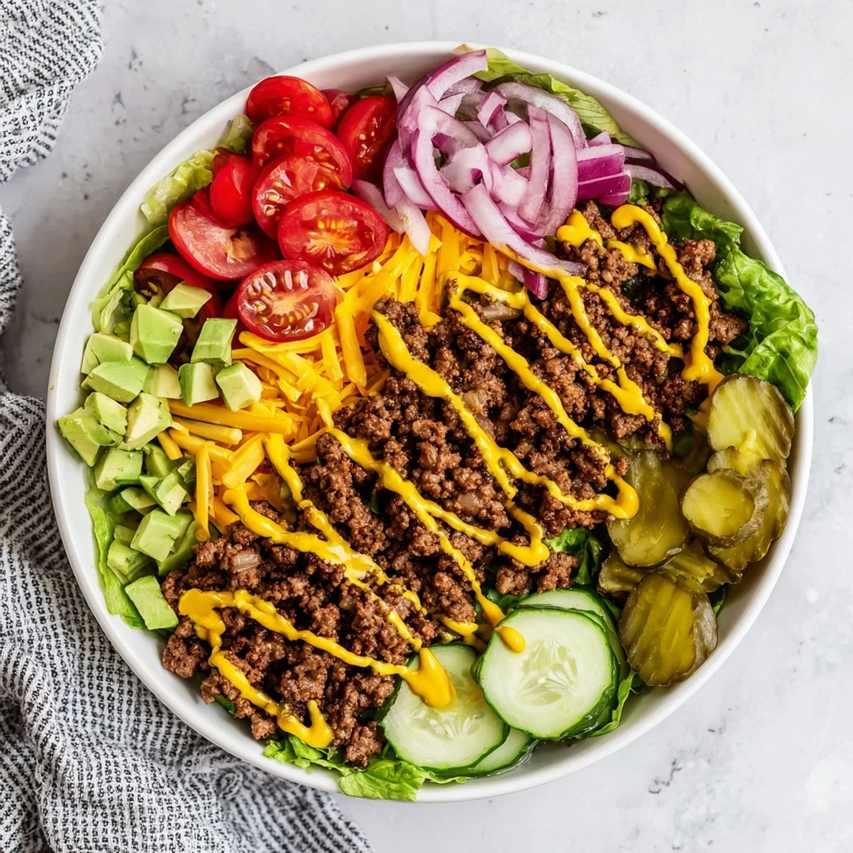 Colorful Burger Bowls served as a low-carb dinner, featuring crunchy lettuce and savory toppings in a bowl.