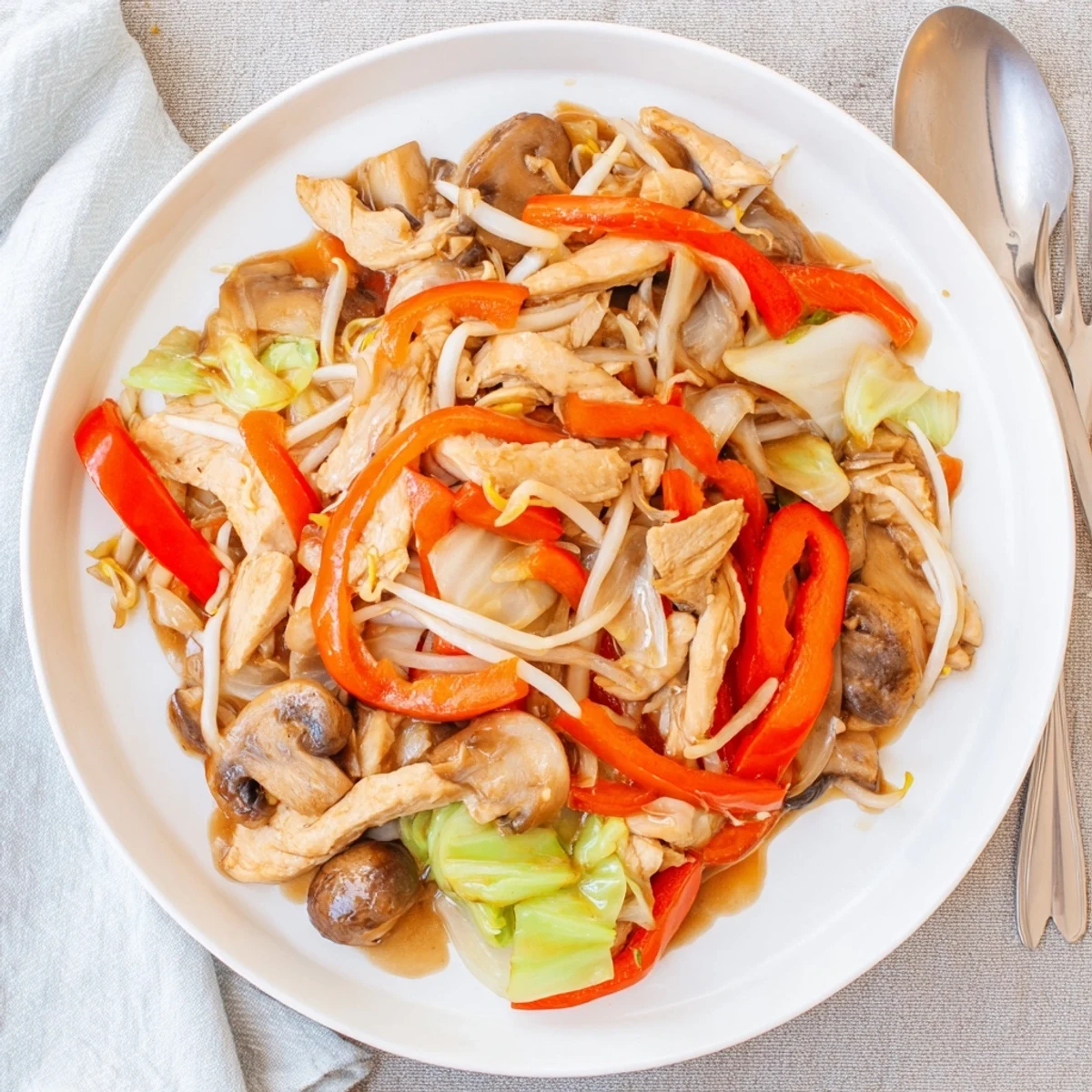 Golden chicken Chop Suey stir-fry with colorful vegetables in glossy savory sauce