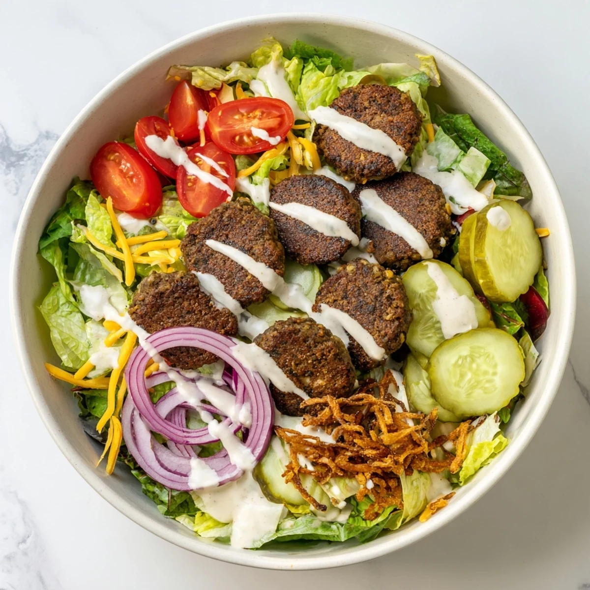 Low-carb smash burger bowl featuring thinly smashed beef, cheddar cheese, avocado slices, and special sauce