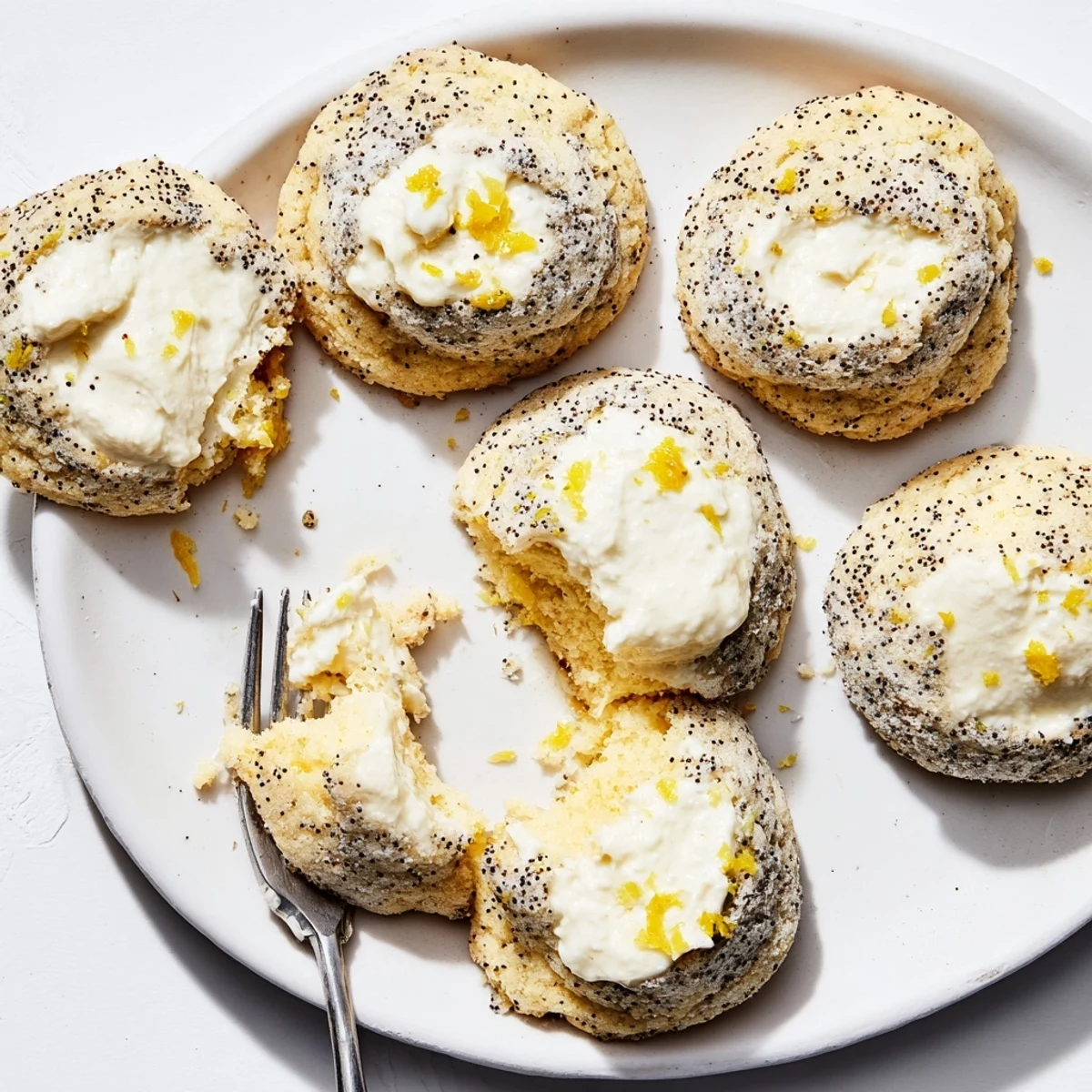 Soft lemon poppy seed cheesecake cookies with creamy center and golden baked edges