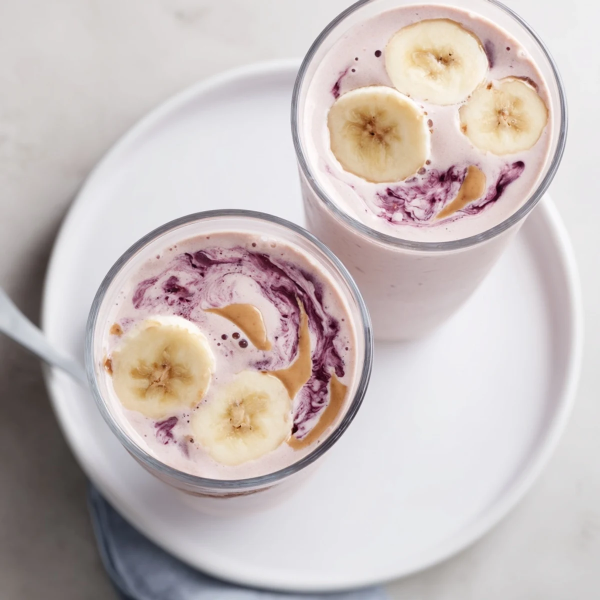 Frosty High Protein Smoothie topped with chia seeds and cinnamon sprinkle