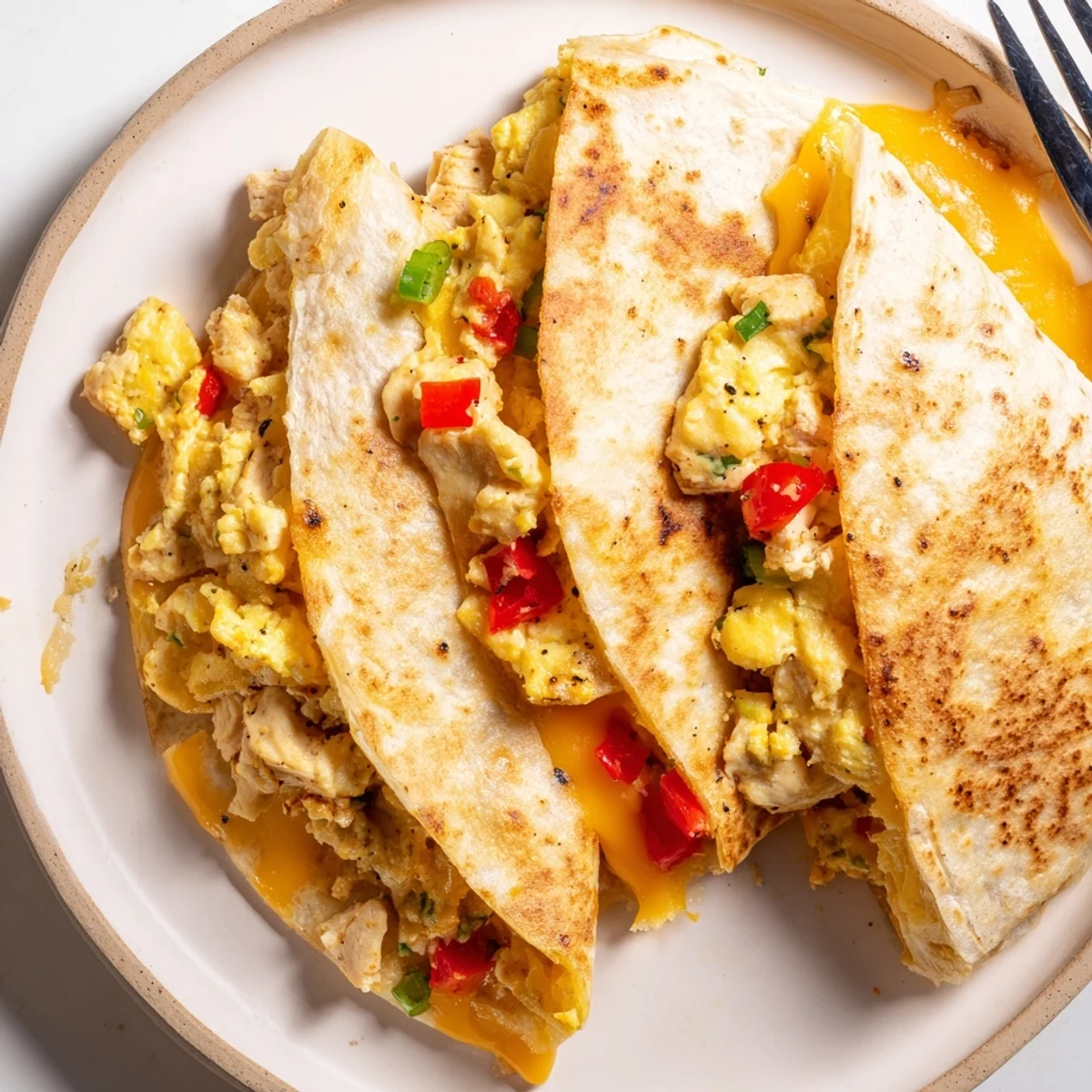 A protein-packed morning plate: shredded chicken and melted cheese in Chicken Breakfast Quesadilla