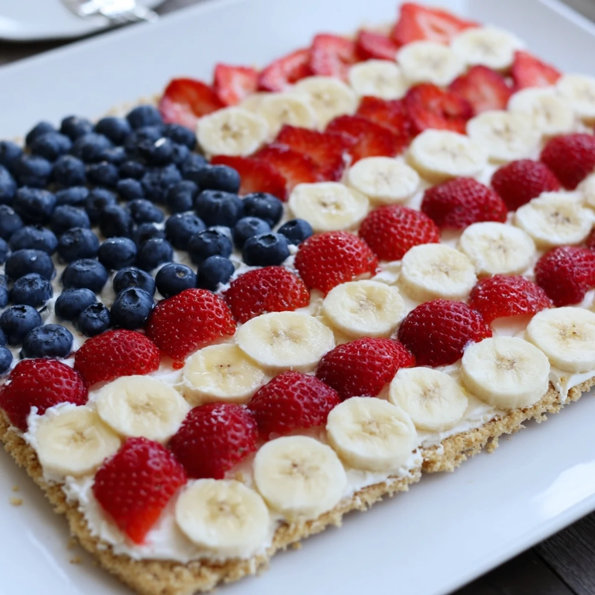 American Flag Fruit Pizza arranged for Fourth of July dessert, colorful, refreshing, ready-to-slice