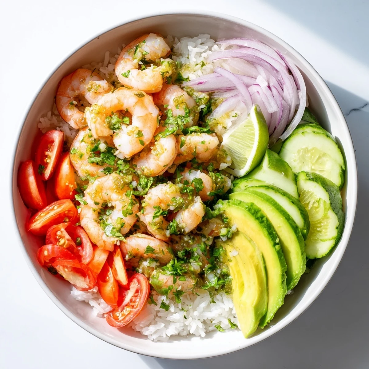 Vibrant garlic shrimp bowl recipe dinner featuring fresh toppings and zesty lime garnish