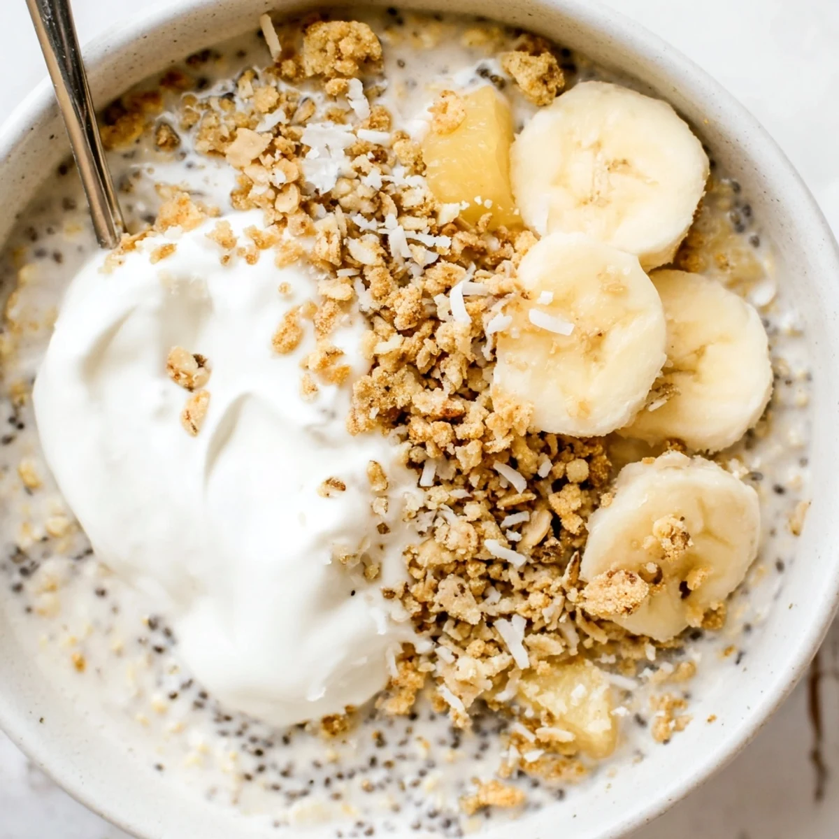 Make-ahead Coconut Cream Pie Overnight Oats jar, silky texture, pineapple or mango garnish