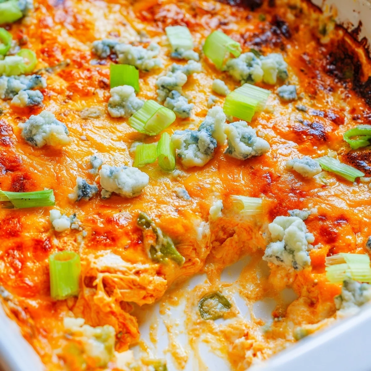Golden bubbling Jalapeno Buffalo Chicken Casserole fresh from the oven with melted cheddar